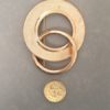 1980s costume jewellery gold brooch with pound coin to show scale