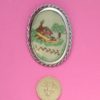 Handmade oval scene stitched brooch scale