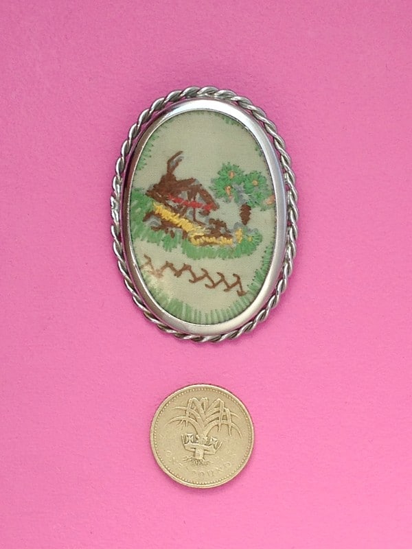 Handmade oval scene stitched brooch scale