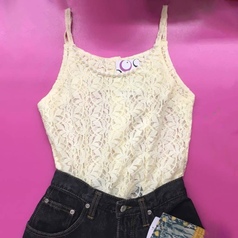 CREAM LACE STRAPPY TOP WITH JEANS ON PINK BACKGROUND