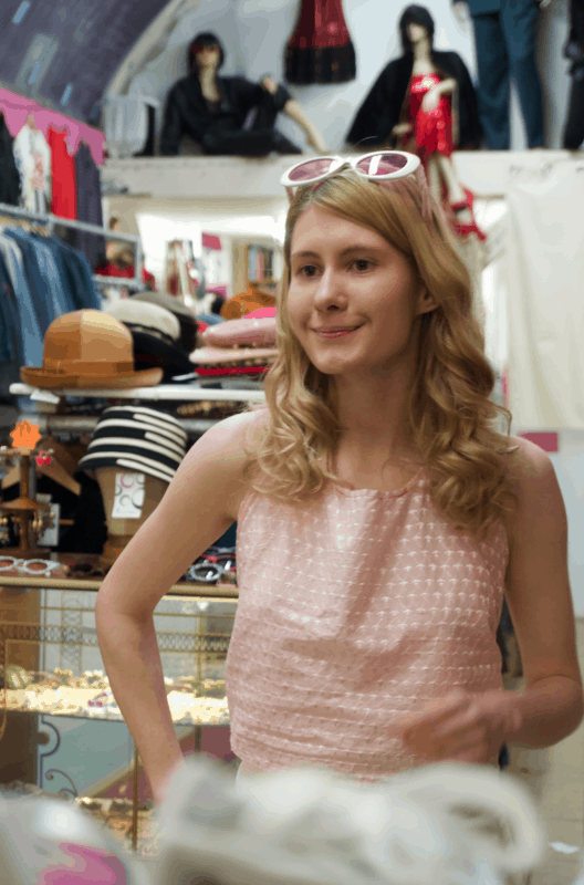 Model in pink summer top and sixties inspired sunglasses at St Cyr Vintage