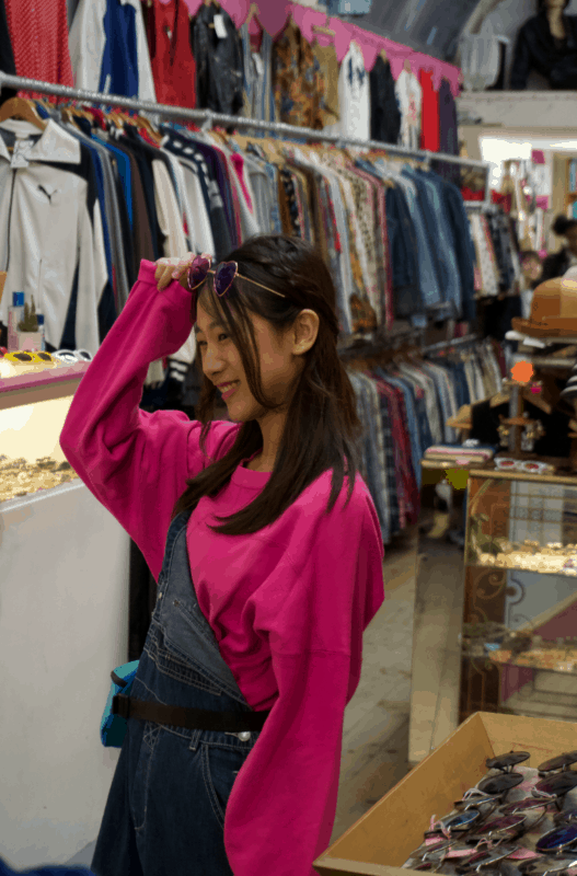 Model wearing dungaree and pink sweatshirt for the St Cyr Vintage Fashion show