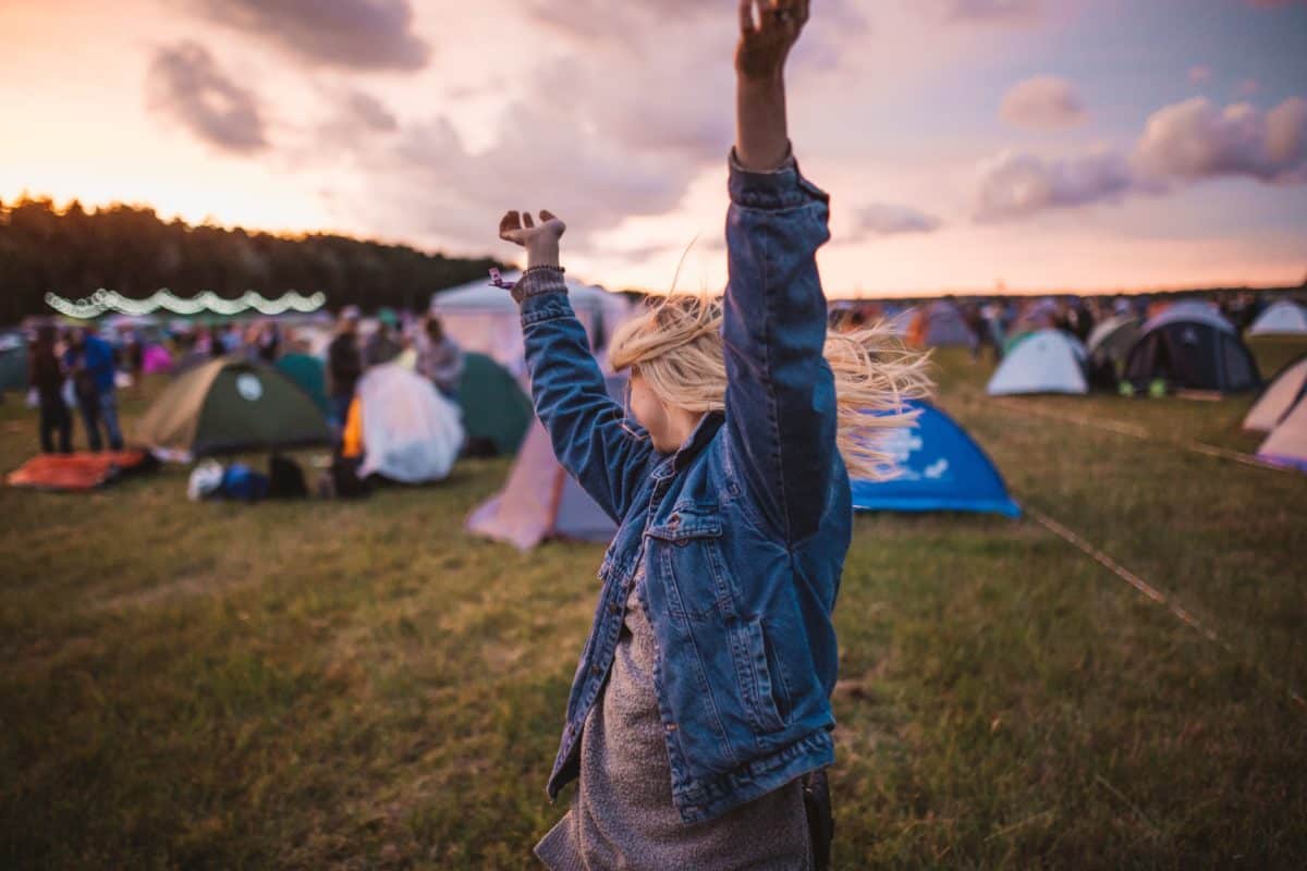 Picture of a woman dancing at a campsite