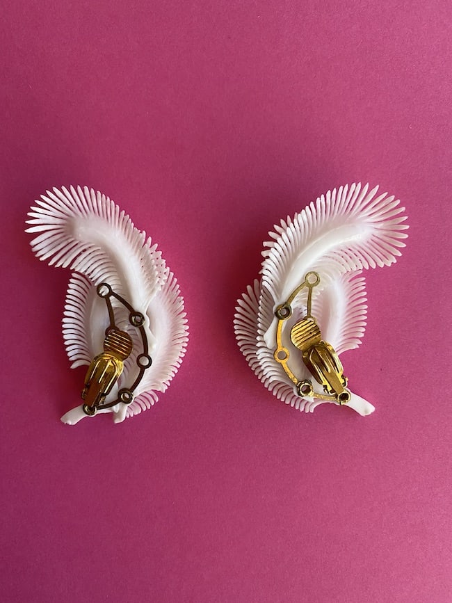 an image showing the back a pair of Deadstock Vintage Feather Earrings in white