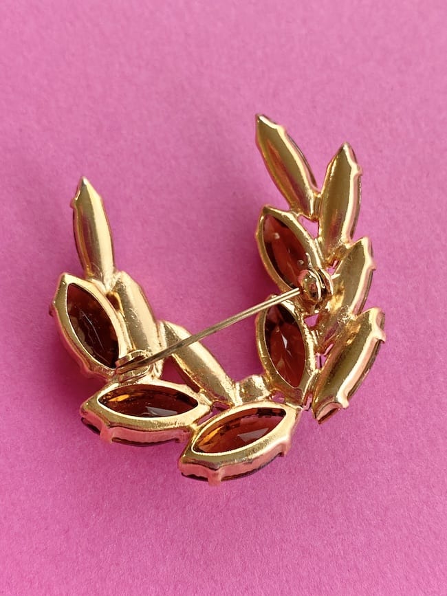 image of the back of a 50s Vintage Brooch Amber glass