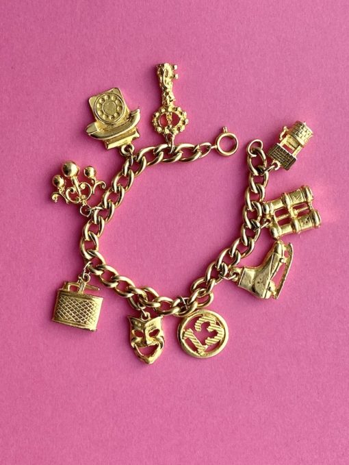 an image showing a golden Vintage ALUCRAFT Charm Bracelet