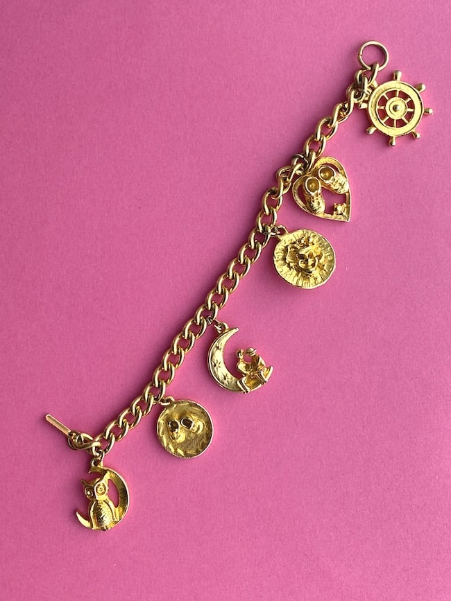 image shows a Vintage Charm Bracelet with charms including a Ship Wheel and moon