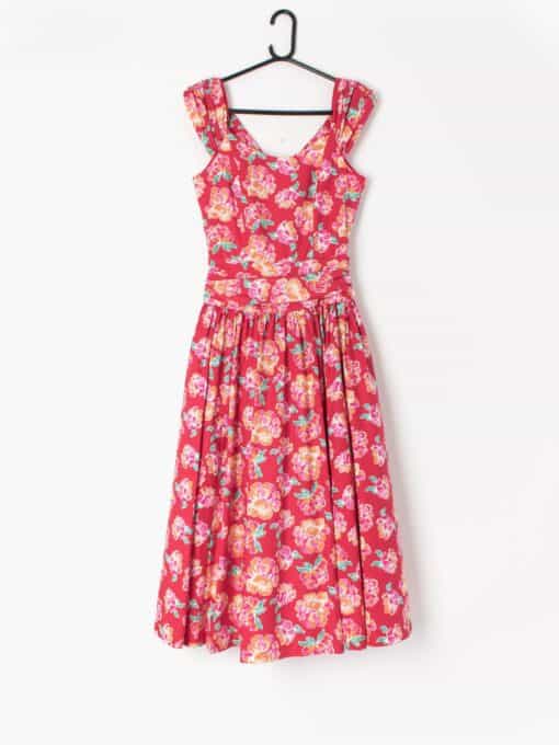 image shows a Vintage Laura Ashley dress in red with large floral print.