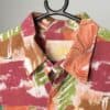Vintage Le Saint bold shirt with vibrant leaf print in reds, orange and green - Large