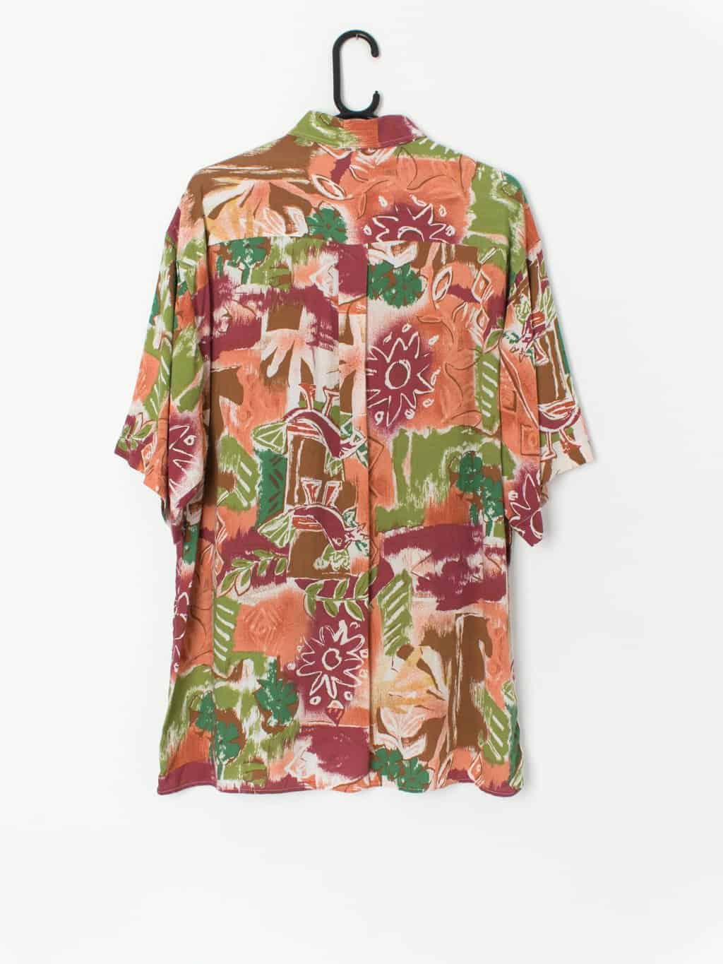 Vintage Le Saint bold shirt with vibrant leaf print in reds, orange and green - Large