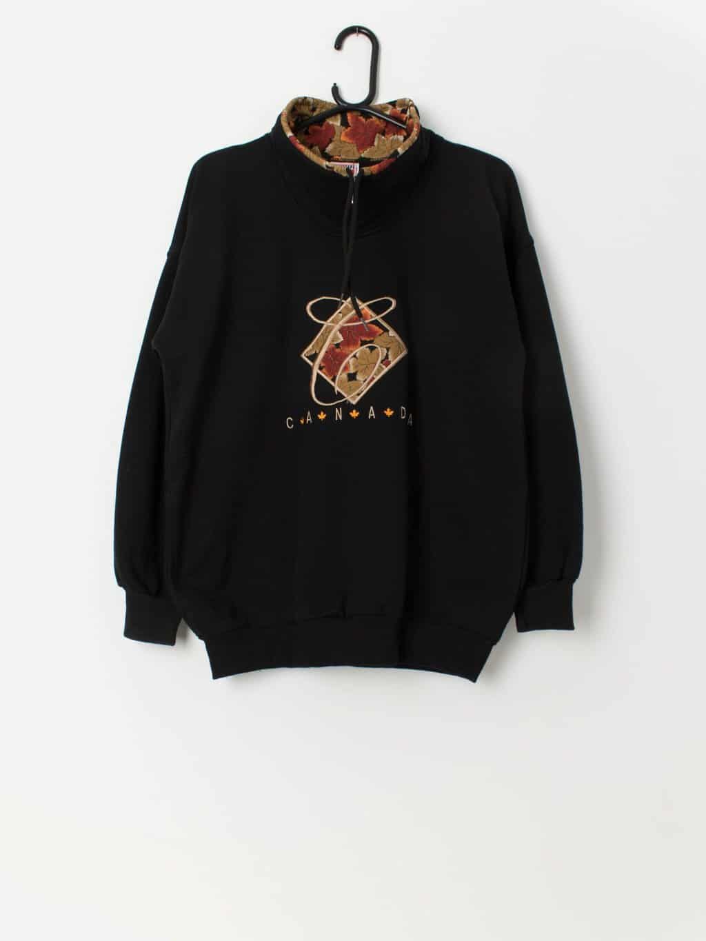 Vintage autumn Canada sweatshirt in black with orange maple leaves - Medium / Large
