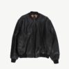 Mens black leather bomber jacket, vintage leather jacket made in England on a white background